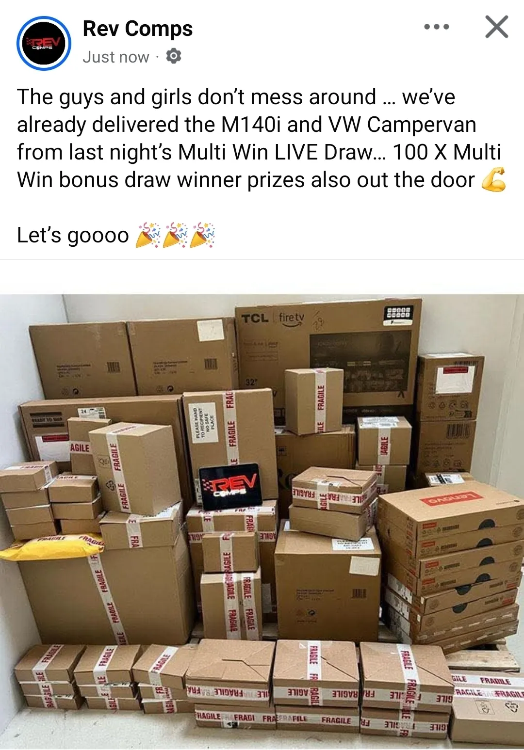 Rev Comps Facebook post saying they had already delivered the M140i and VW Campervan from the Multi Win live draw, with 100 Multi Win bonus draw winner prizes also out the door, above a photo of stacked, taped prize boxes ready for dispatch